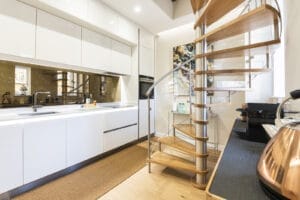 Spiral Staircase with Oak Treads and Curved Perspex Balustrade