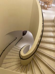 Stone Clad Curved Metal Staircase